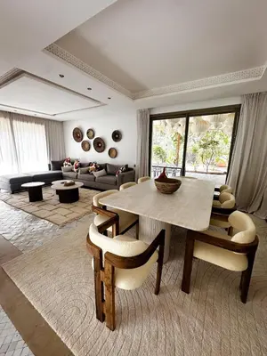 a large living room with a table and chairs at Luxury Villa 4 Bedrooms with Big Pool 5km from Medina in Marrakech