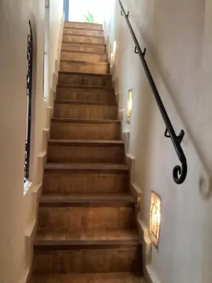 a stairway with brown steps and a window at Riad Awel Oasis Privée au coeur de la Medina in Marrakech