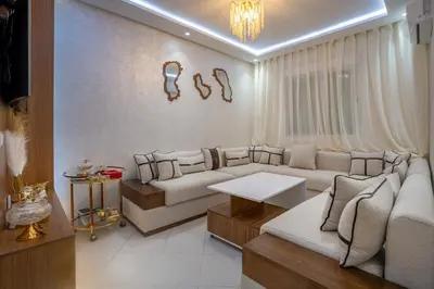 a living room with a couch and a table at Titrit Apartment Marrakech in Marrakech