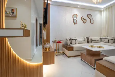 a living room with a couch and a table at Titrit Apartment Marrakech in Marrakech