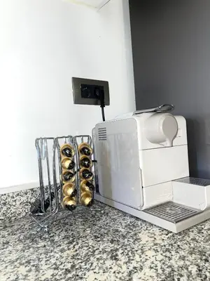 a toaster oven and some donuts on a counter at Prestigia jade in Marrakech