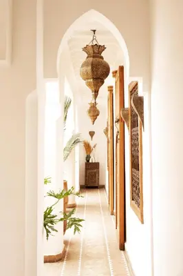 a hallway with a chandelier in a building at Riad RK Suites & Spa in Marrakech