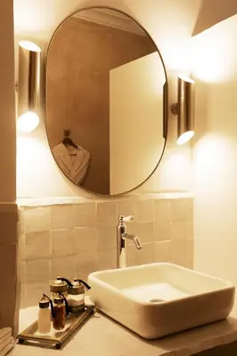 a bathroom with a sink and a mirror at Riad RK Suites & Spa in Marrakech