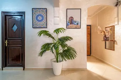 a plant in a hallway next to a door at Cozy apartment, 2 bedrooms, 10 min from airport and Medina in Marrakech