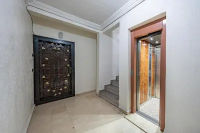 a room with a door with a staircase in it at Cozy apartment, 2 bedrooms, 10 min from airport and Medina in Marrakech