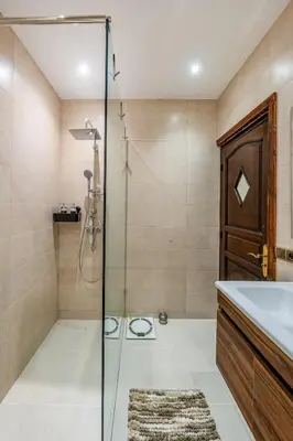 a bathroom with a shower and a sink at Cozy apartment, 2 bedrooms, 10 min from airport and Medina in Marrakech