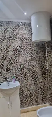 a bathroom with a sink and a toilet at Apartment Majdoline in Marrakech