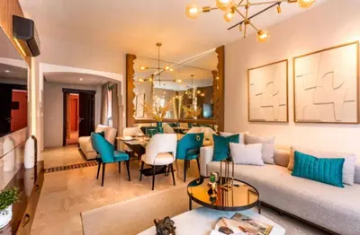 a living room with a couch and a dining room at Suite Ultra Deluxe, Babylone, Ultra Confort, Hyper-Centre, Marrakesh in Marrakech