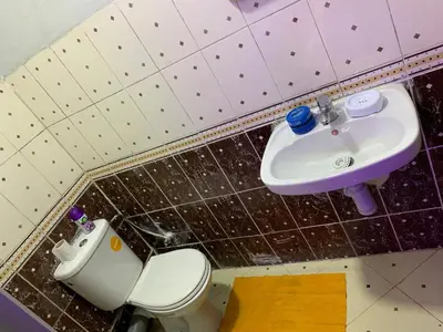 a bathroom with a toilet and a sink at AJ Apartment Ideal for Families, Married Couples, and Solo Travelers in Marrakech