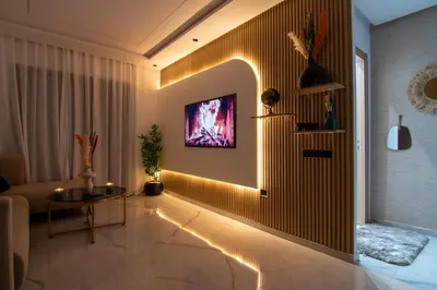 a living room with a tv on a wall at Hivernage 50 in Marrakech