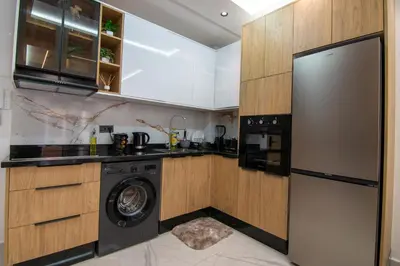 a kitchen with a washing machine and a washer at Hivernage 50 in Marrakech