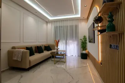 a living room with a couch and a table at Hivernage 50 in Marrakech