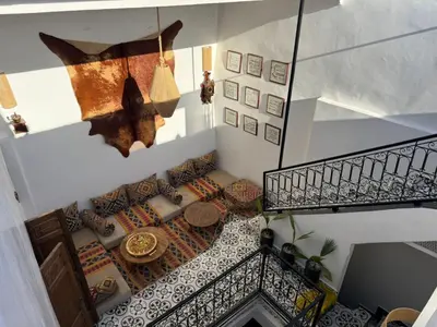 an overhead view of a living room with a staircase at Dar Skouri in Marrakech