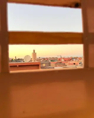 a view of a city from a window at Dar Skouri in Marrakech
