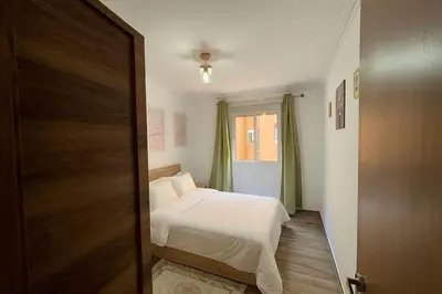 a small bedroom with a bed and a window at NS 53 by KMREI Properties in Marrakech