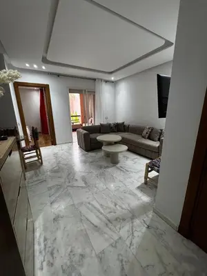 a living room with a large marble floor at Garden level & pool, cozy apartment queen size bed in Marrakech