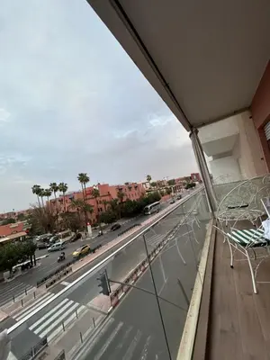 a balcony with a view of a city street at Said in Marrakech