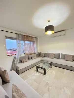 a living room with a couch and a table at Said in Marrakech