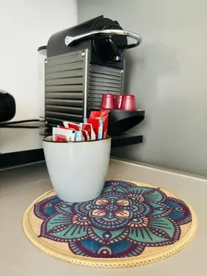 a coffee maker and a cup on a table at Joyau Moderne Appartement in Marrakech