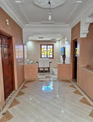 a large room with a table and a dining room at Oasis Menara in Marrakech
