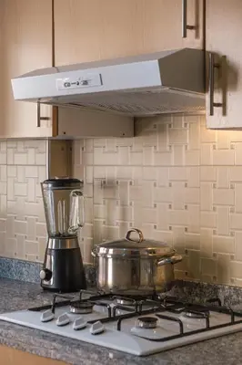 a pot on a stove with a blender on it at apartment gilez in Marrakech