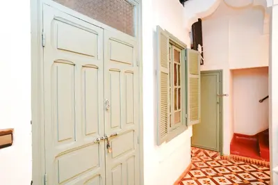 a hallway with a door and a room with a floor at Dar JOMANA in Marrakech