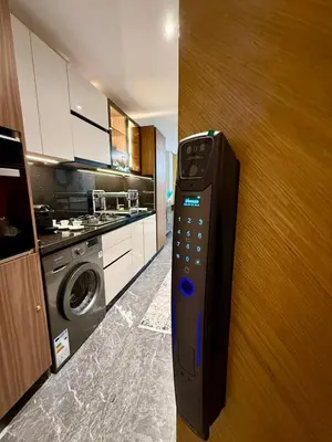 a remote control in a kitchen next to a door at Elite studio 17 in Marrakech