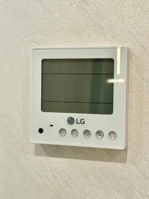a white microwave on the wall of a room at Elite studio 17 in Marrakech