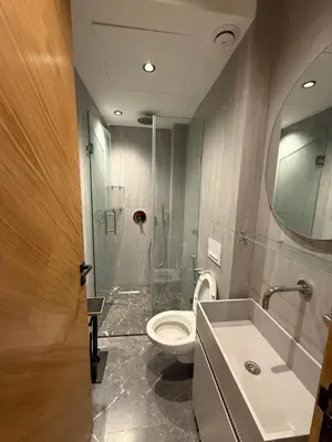 a bathroom with a toilet and a sink and a shower at Elite studio 17 in Marrakech