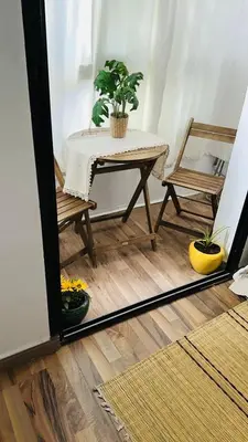 a table and chairs in a room with a mirror at Marrakech Soft Escape in Marrakech