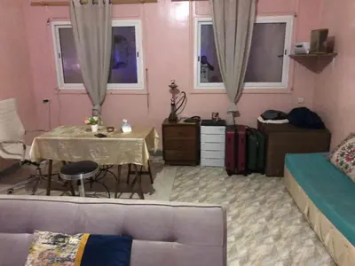 a living room with a couch and a table at ÉTABLISSEMeNT BEAU SÉJOUR in Marrakech