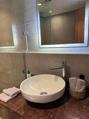 a white sink in a bathroom with a mirror at Marrakech Palm View in Marrakech