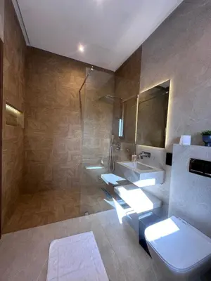 a bathroom with a toilet and a sink and a shower at Villa Tiffany NORIA GOLF in Marrakech