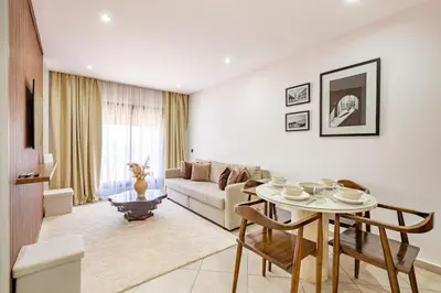 a living room with a couch and a table at Modern & cozy apartment in Marrakech