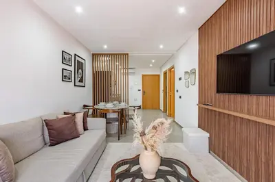 a living room with a couch and a table at Modern & cozy apartment in Marrakech