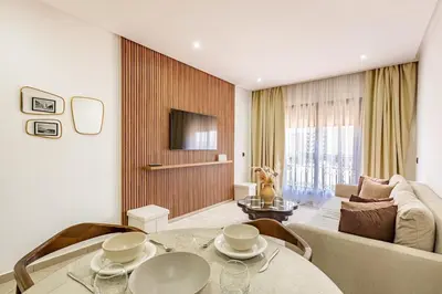 a living room with a couch and a table at Modern & cozy apartment in Marrakech