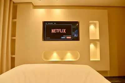 a television on a wall with a netflix sign at Luxurious colorful apartment in Marrakech