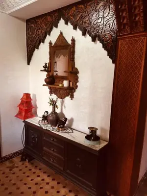 a room with a dresser with a mirror on the wall at Air Conditioned Appartment across YSL Museum in Marrakech