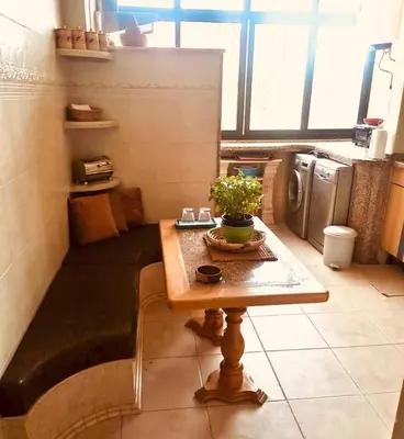 a kitchen with a table with a plant on it at Air Conditioned Appartment across YSL Museum in Marrakech