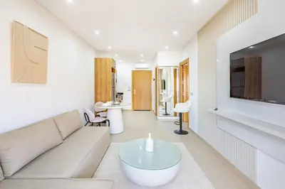a living room with a couch and a table at Appartement chic près de la gare in Marrakech