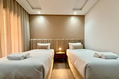 a room with two beds with towels on them at Two Bedroom Apartment with Pool in Marrakech