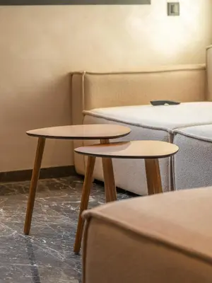 two tables in a room with couches at appartement Confort & modernité au centre de Marrakech in Marrakech