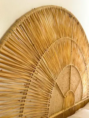 a wicker basket sitting on top of a bed at A flat near the airport in Marrakech