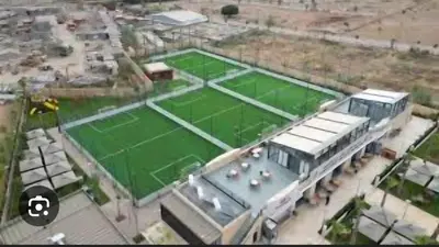 an aerial view of a tennis court in a city at Bohemian & Moroccan Apartment Close to Airport & Medina in Marrakech