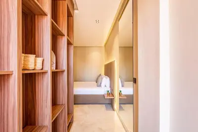 a bedroom with a bed and a mirror at Apartment with swimming pool in Marrakech