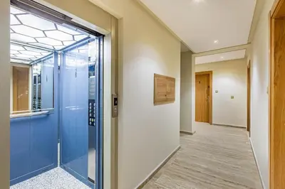 a hallway with a glass door and a hallway with a hallway at Escapade intime en ville rouge in Marrakech