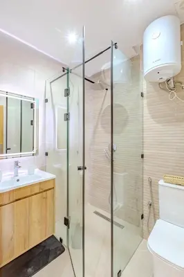 a bathroom with a shower and a toilet and a sink at Escapade intime en ville rouge in Marrakech