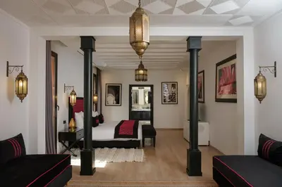 a living room with a bed and a couch at Villa Yali in Marrakech