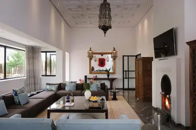 a living room with a couch and a table at Villa Yali in Marrakech
