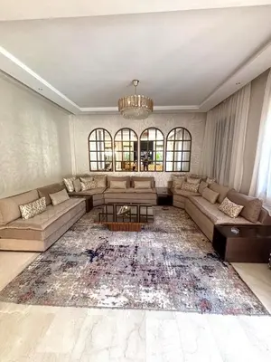 a living room with a couch and a table at Villa 4 Suites with Pool, near Hivernage in Marrakech